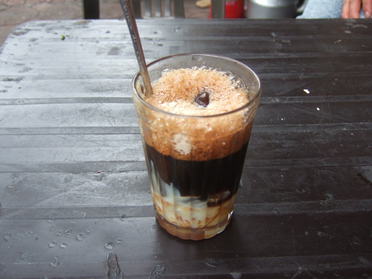 Vietnamese-style coffee with condensed milk, illustrative — not a photo of a specific Prague café